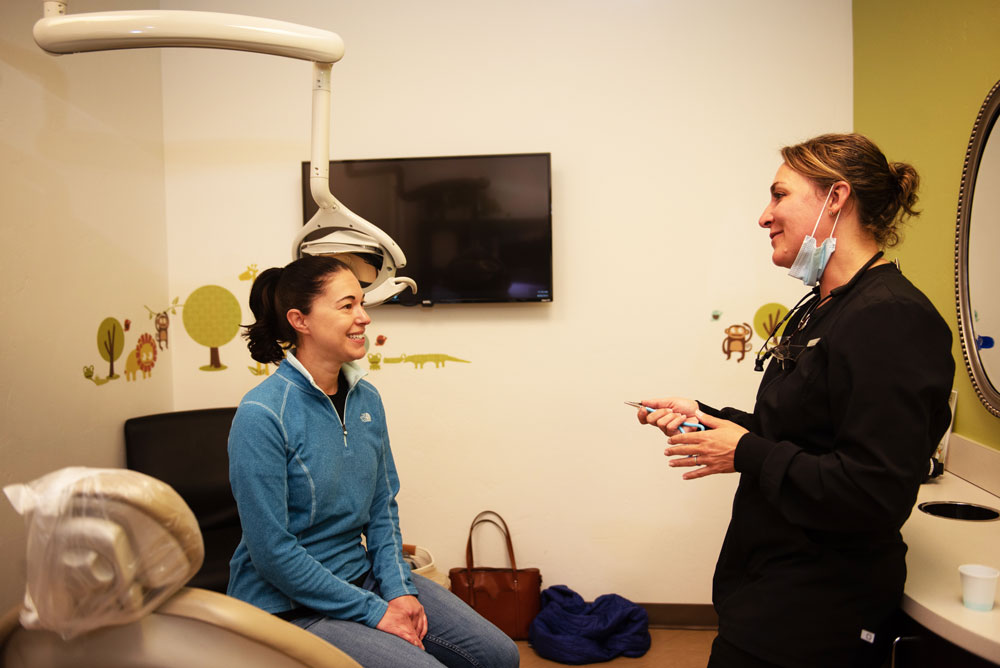 hygienist talking to patient