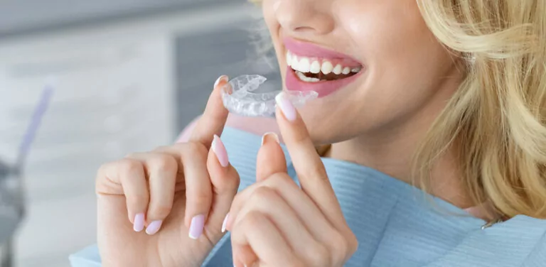 Female holding invisalign ready to wear
